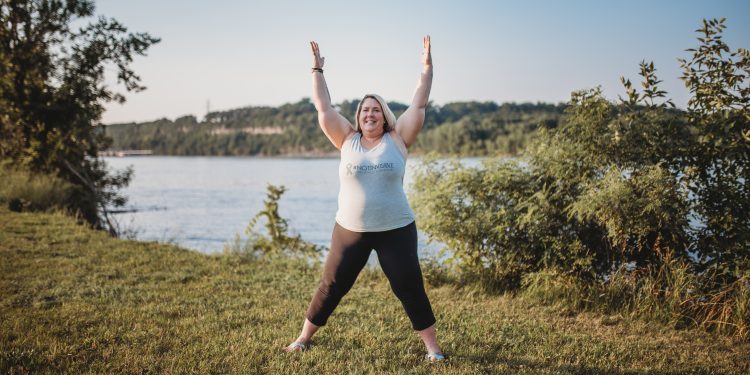 Premium Photo | A woman practices yoga in a white room she is in rock star  pose